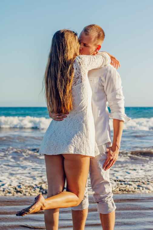 beach couple fun happiness